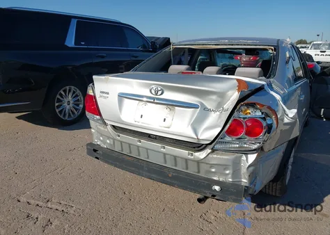 2005 Toyota Camry Le z USA, uszkodzony, nr VIN 4T1BE30K05U559024
